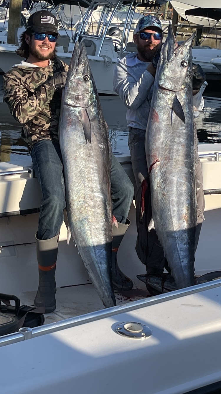 Two huge wahoo - SeaCo Fishing Charters Captain Ricky Poupore (right) with Captain Dalton Shank (left) showing off an amazing feat of TWO huge wahoo caught same day while fishing off St. Augustine, Florida