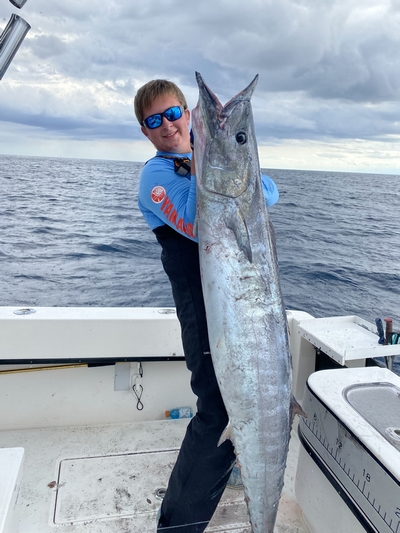 Cody with Wahoo - SeaCo Fishing Charters Wintertime trolling with SeaCo Fishing Charters lands a large wahoo for this angler; St. Augustine, Florida
